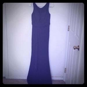 Floor length purple bridesmaids dress.